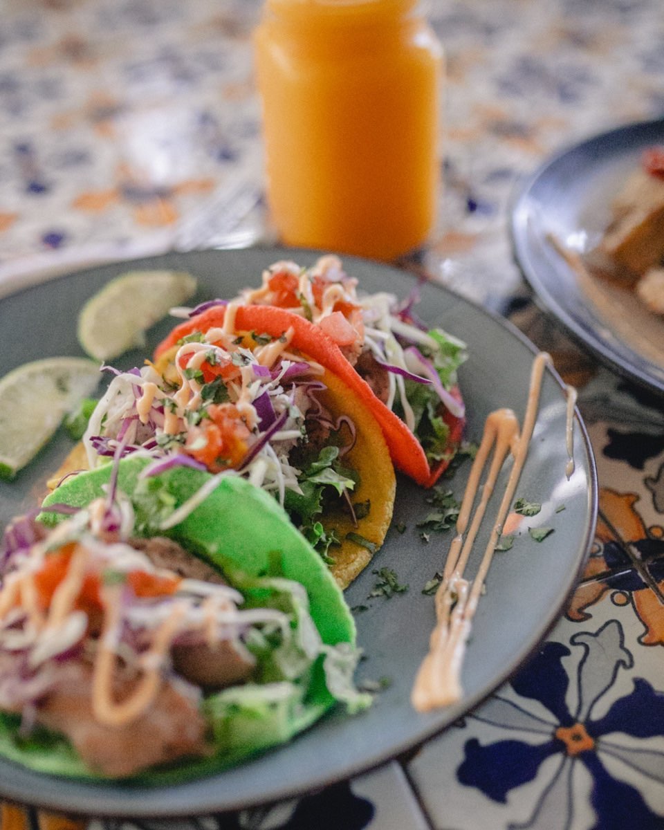 Rainbow tacos, a Costa Rican food, on a plate.