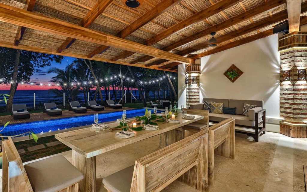 A dining table beside swimming pool at Casa Teresa, Costa Rica
